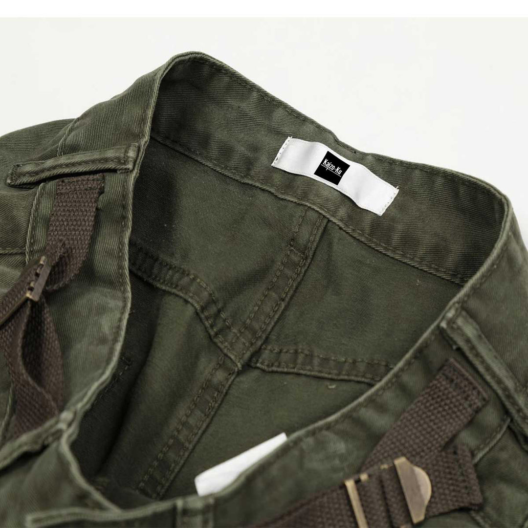 A zoomed-in view of the olive green fabric and reinforced stitching, highlighting the durability and premium quality of these streetwear cargo pants.