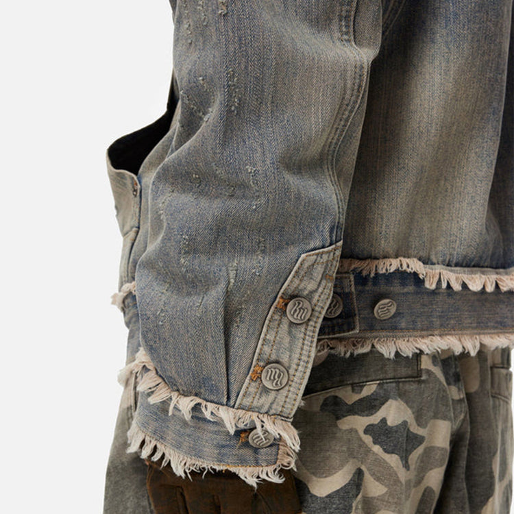 Zoomed-in view of the cuff and sleeve on the distressed denim hoodie, highlighting the attention to detail and high-quality construction.