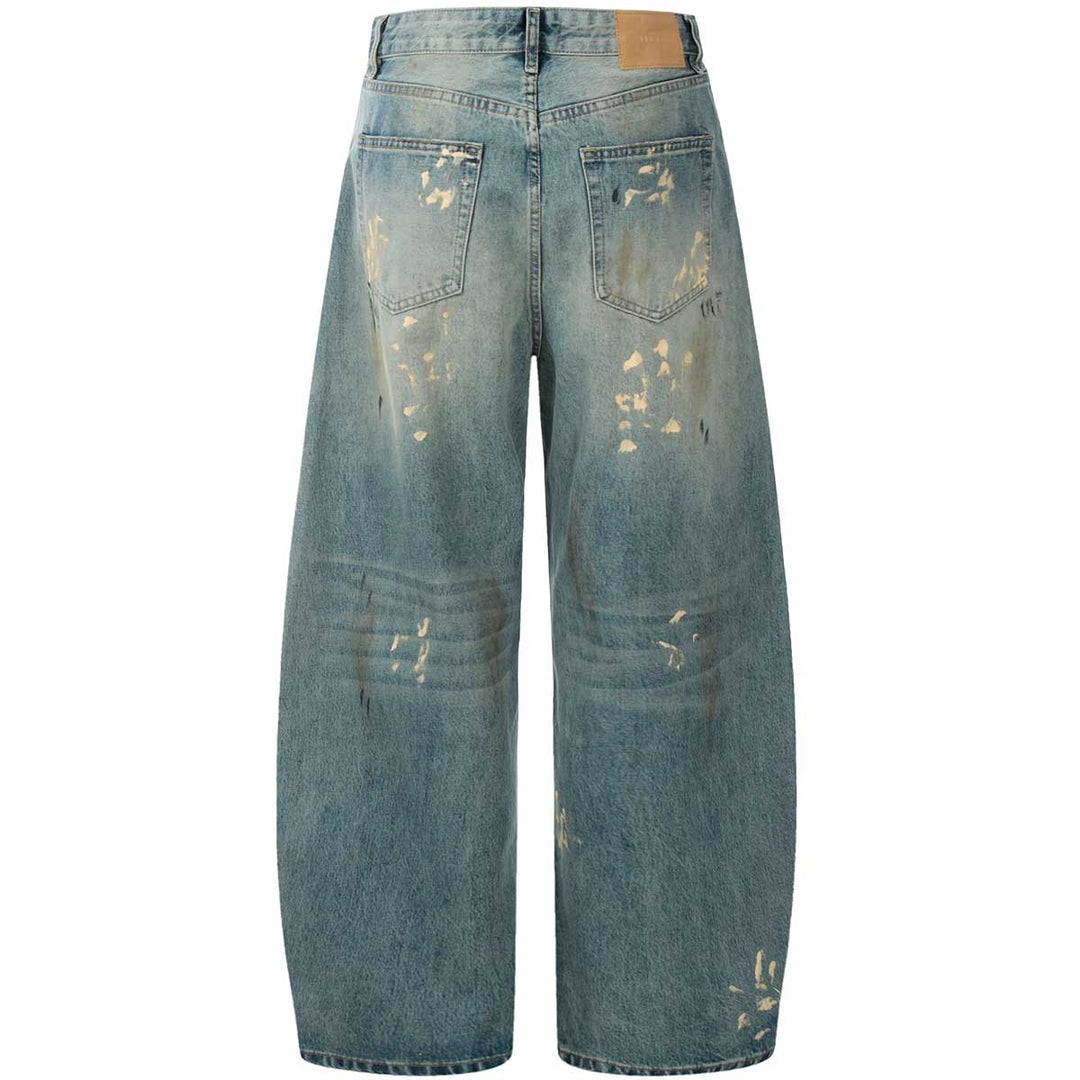 A back view of oversized distressed jeans, showcasing the premium vintage-style denim with subtle distressed accents for a unique urban look.