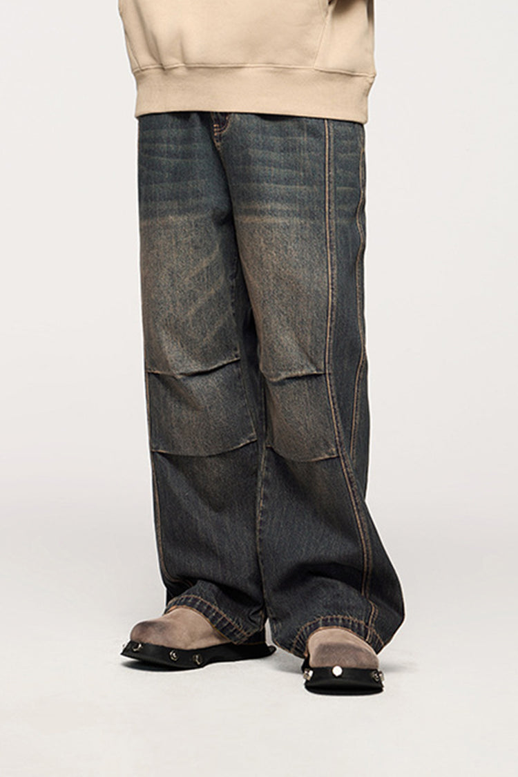 The blue wide-leg jeans styled with a casual beige top, perfect for a relaxed and trendy streetwear look.