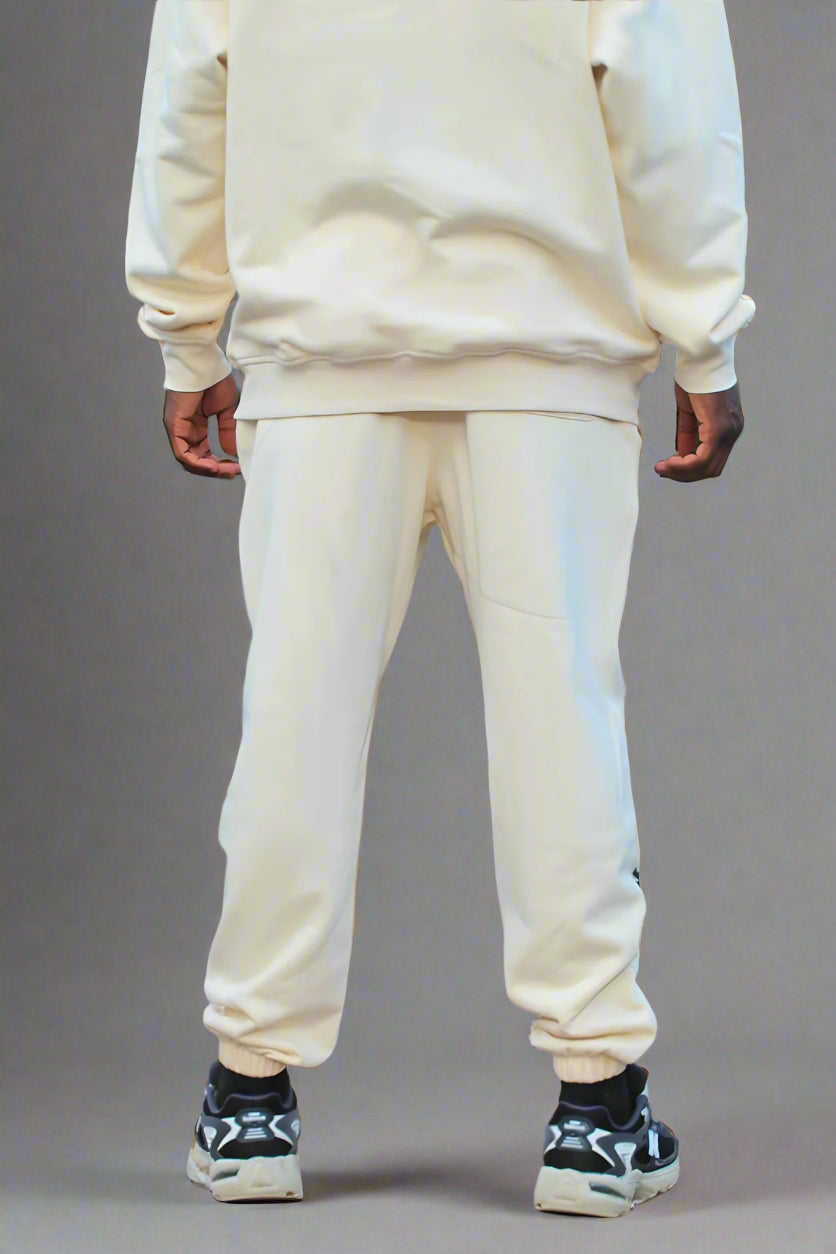 Back view of the Kaizo-Ku beige jogger, showing the clean lines and subtle stitching details.