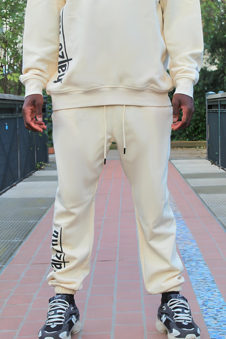 Model wearing the Kaizo-Ku beige jogger, displaying its relaxed fit and comfortable waistline from the front.