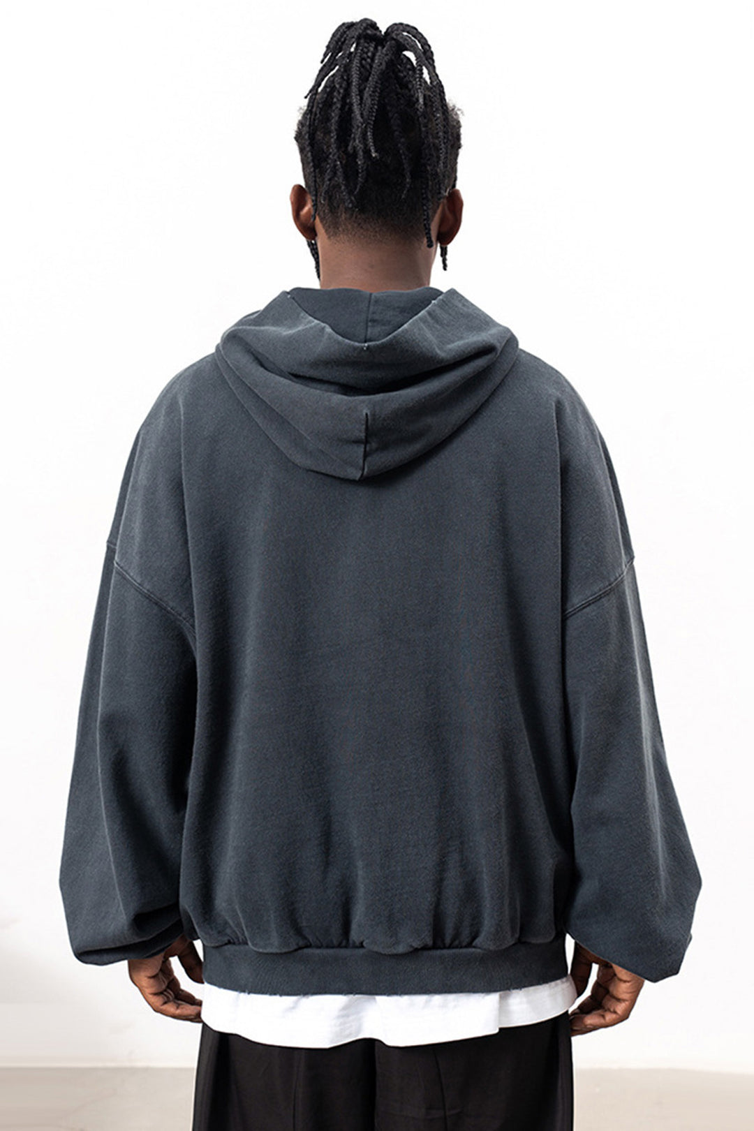 Flat lay of the back design of the Kaizo-Ku Distressed Skull Hoodie, showcasing the clean lines and subtle distressed details for an edgy look.