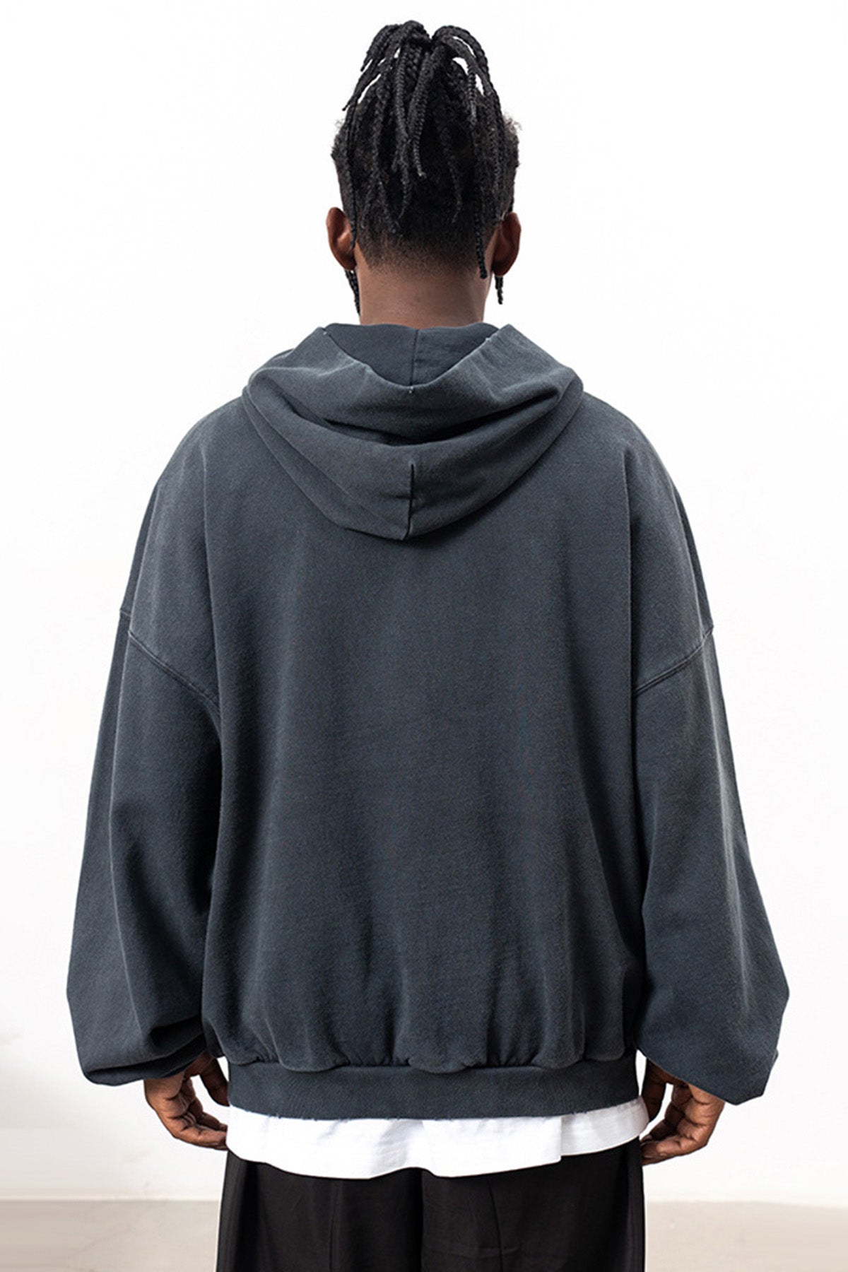 Flat lay of the back design of the Kaizo-Ku Distressed Skull Hoodie, showcasing the clean lines and subtle distressed details for an edgy look.