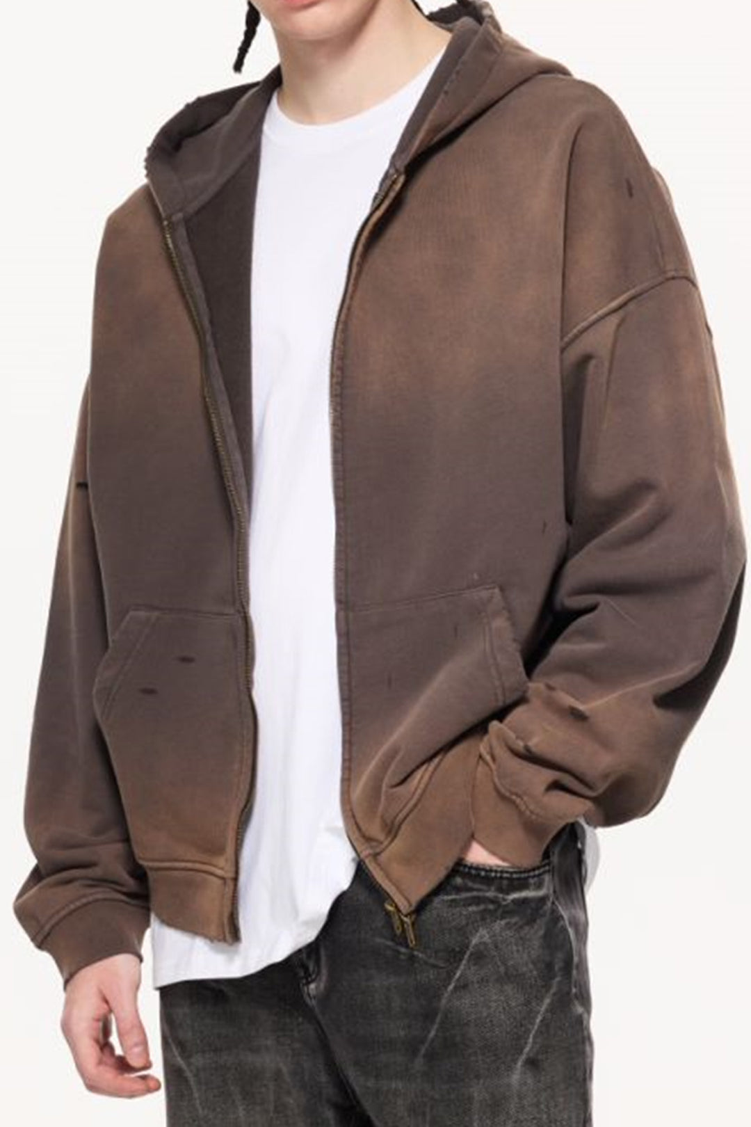 A front view shot of a model wearing the Charcoal Gray Kaizo-Ku Vintage Hoodie, paired with dark denim for an urban-inspired outfit.