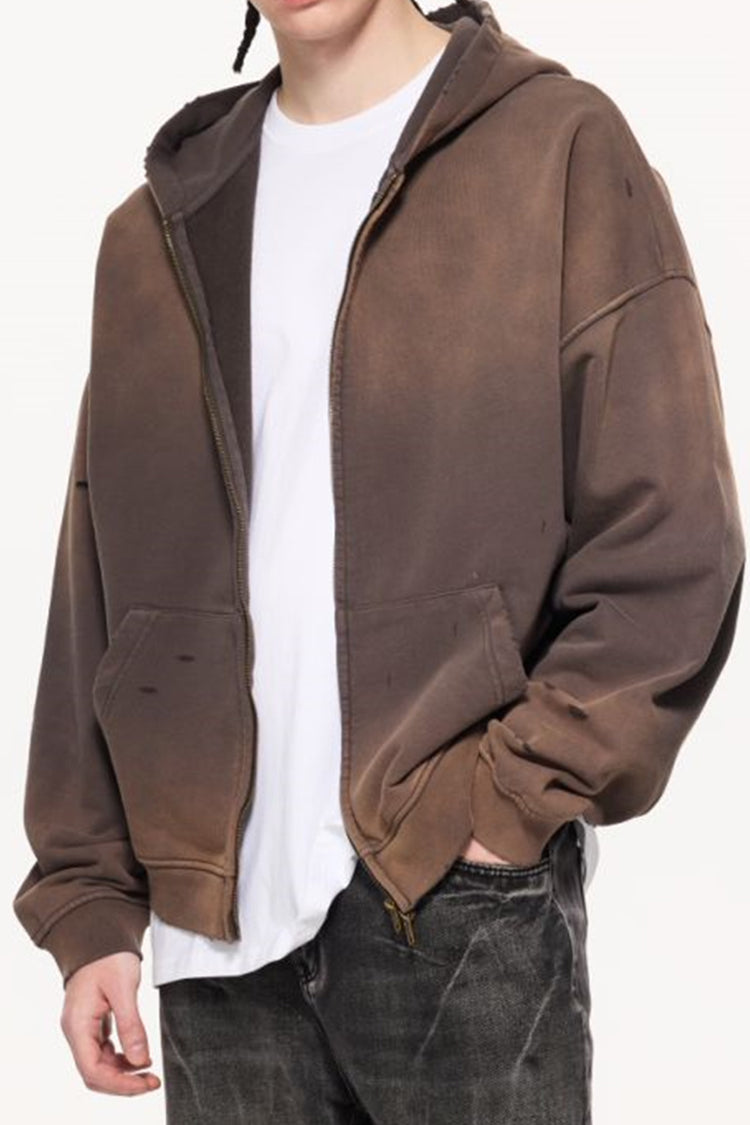 A front view shot of a model wearing the Charcoal Gray Kaizo-Ku Vintage Hoodie, paired with dark denim for an urban-inspired outfit.
