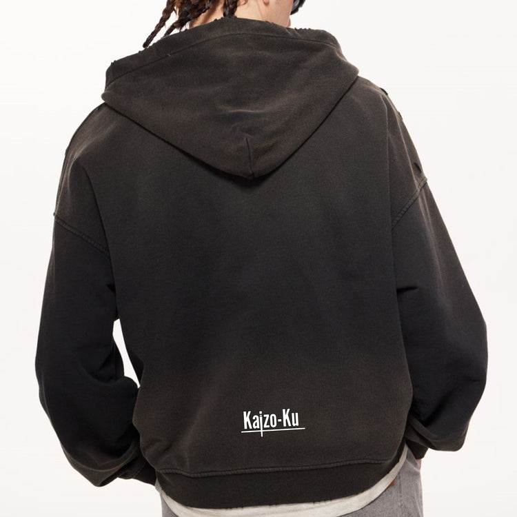  A side profile shot of a model wearing the Charcoal Gray Kaizo-Ku Vintage Hoodie, paired with dark denim for an urban-inspired outfit.