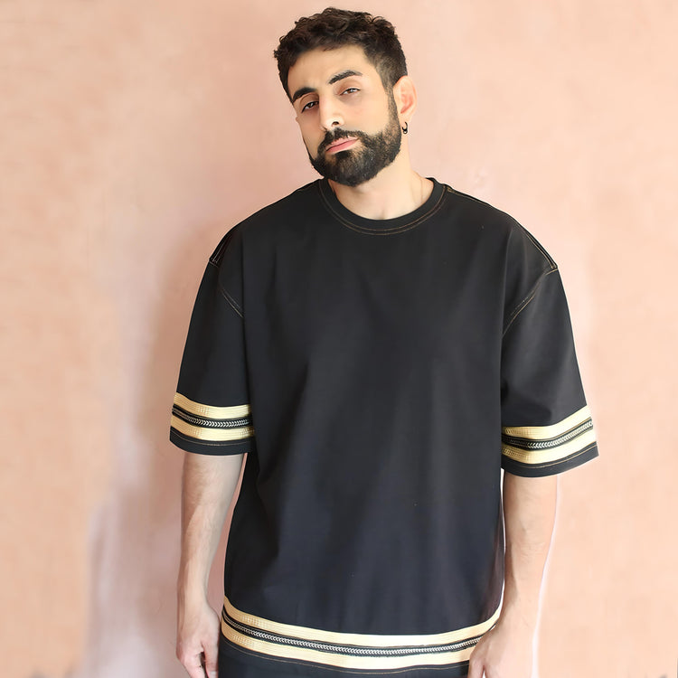 A front view of the t-shirt, featuring detailed sfifa silk embellishments on the sleeves and hem, providing a sophisticated blend of traditional and contemporary fashion elements.