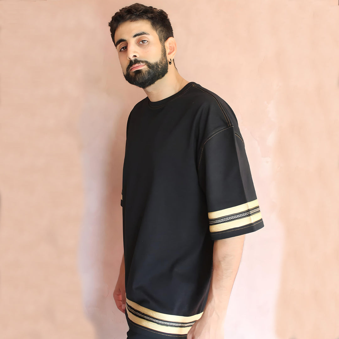 The model presents a stylish profile view, highlighting the t-shirt's elegant design and the seamless integration of sfifa silk trims for a chic urban look.