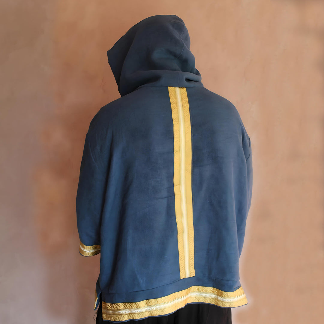 Profile view focusing on the stylish flow of the linen fabric and the cultural accents that elevate the hoodie’s design.