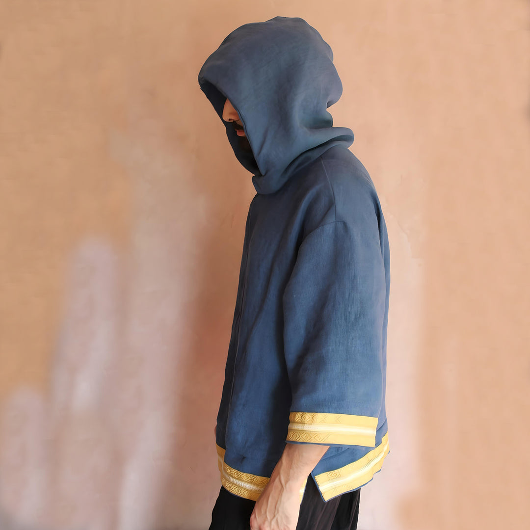 Model side view with the hood on, presenting the hoodie’s versatility and cultural elegance.