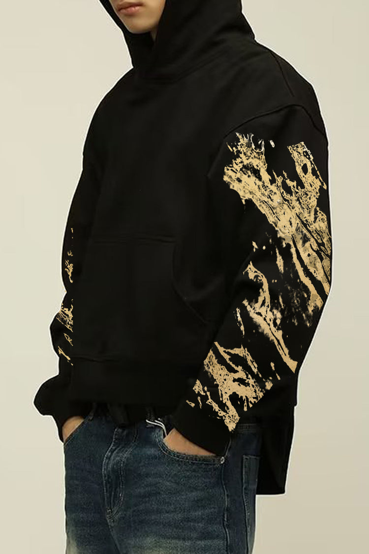 Side view of the Kaizo-Ku Gold Splatter Skull Hoodie highlighting the splatter design on the sleeves.