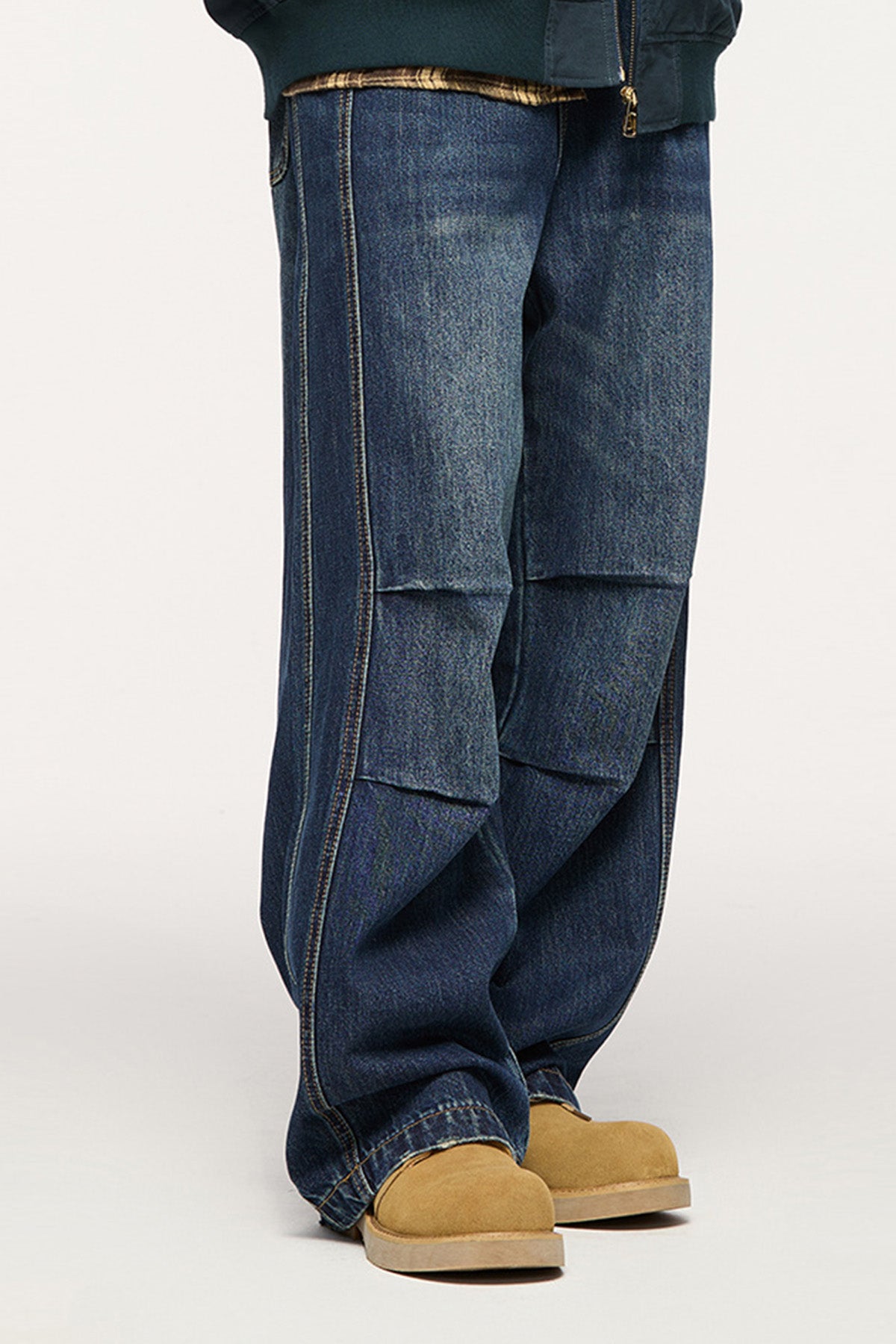 The blue baggy jeans styled with casual sneakers and a hoodie, emphasizing their versatility and urban appeal.