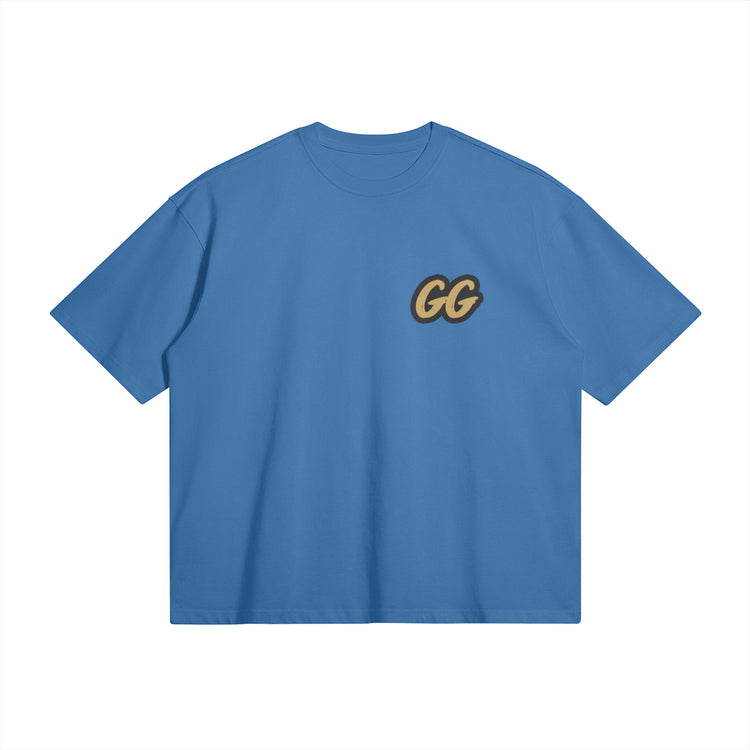 Front view of the Barjoo_Tv Oversized T-shirt in blue, featuring the sleek "GG" emblem.