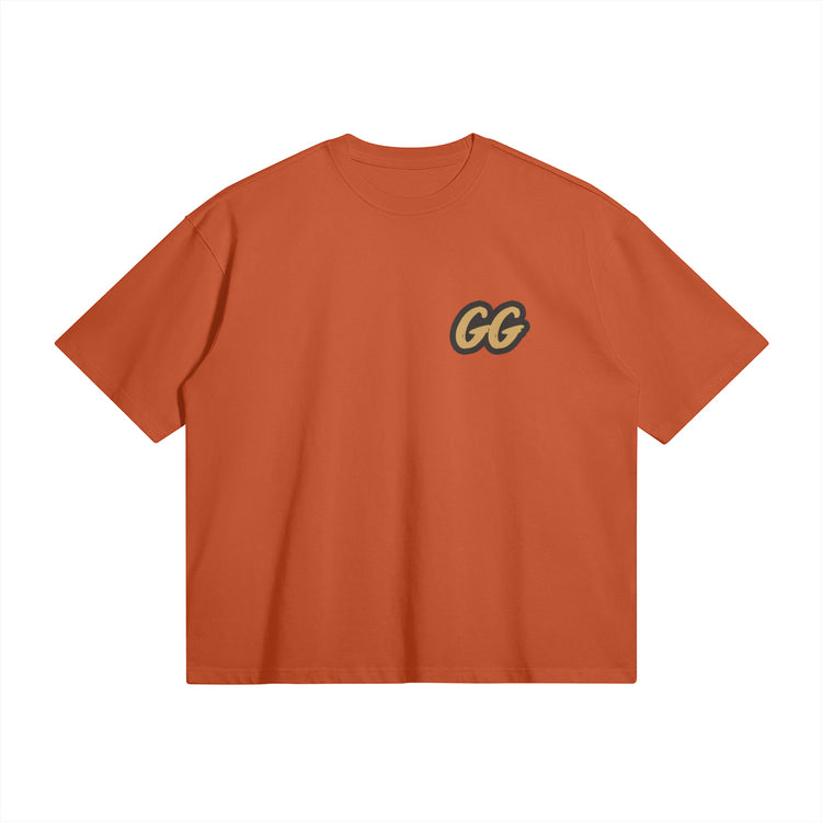 Front view of the Barjoo_Tv Oversized T-shirt in orange, featuring the sleek "GG" emblem.