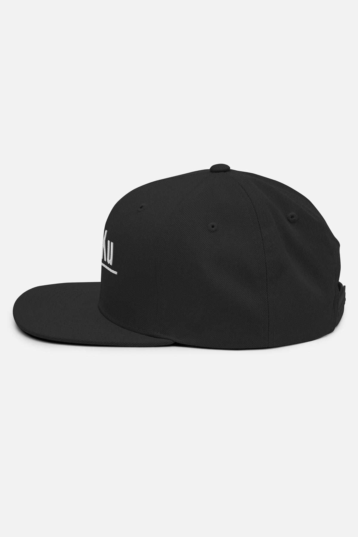 Side profile of the Kaizo-Ku Classic Snapback in Black, highlighting the clean lines and iconic logo design for an urban, minimalist look.