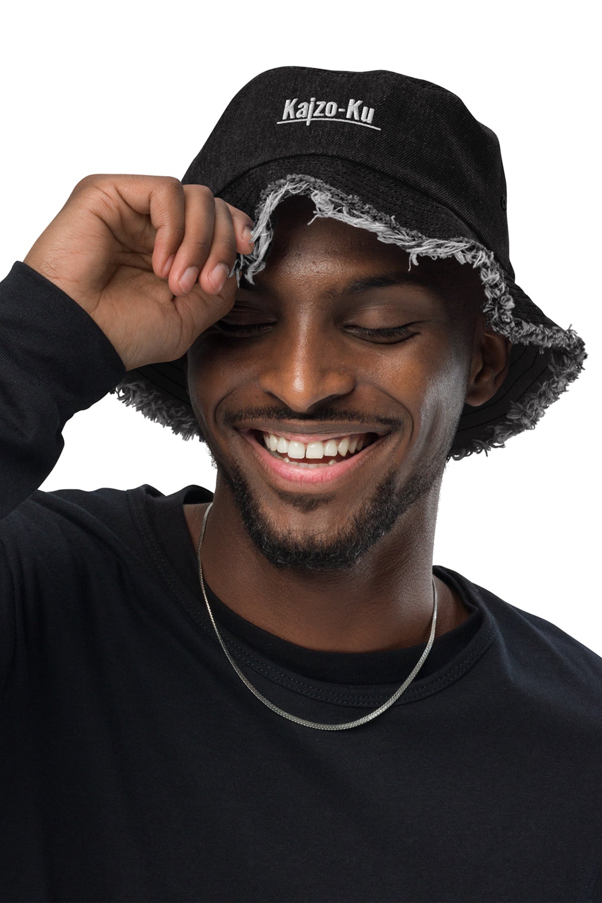 Front view of  a model wearing the Kaizo-Ku Distressed Denim Bucket Hat in Black, showcasing the embroidered logo and rugged, frayed edges that add an edgy touch.