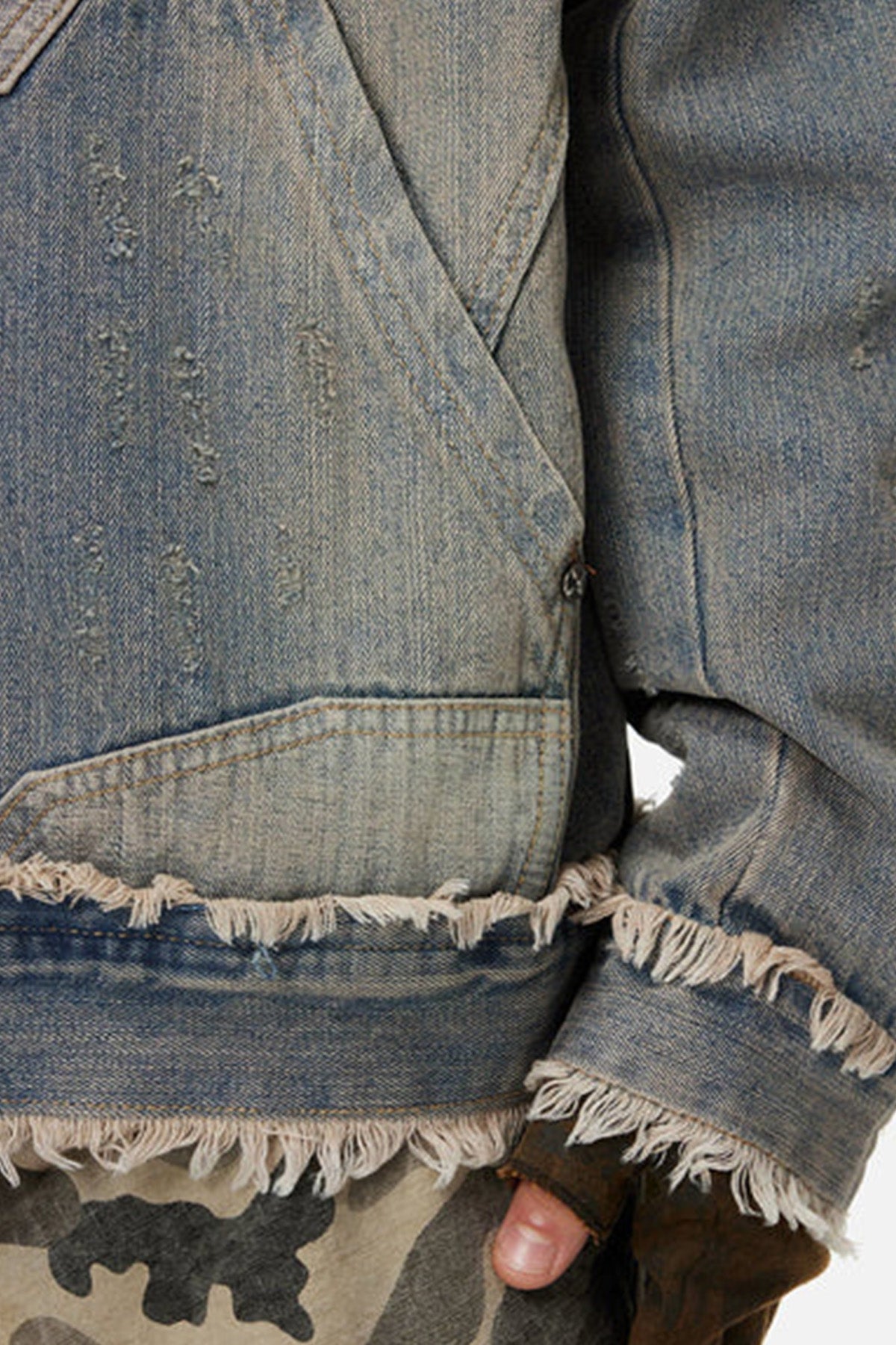 close look up at  the distressed denim hoodie