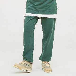 Forest Green Heavyweight Baggy Joggers, echoing the serene and lush tones of the wilderness.