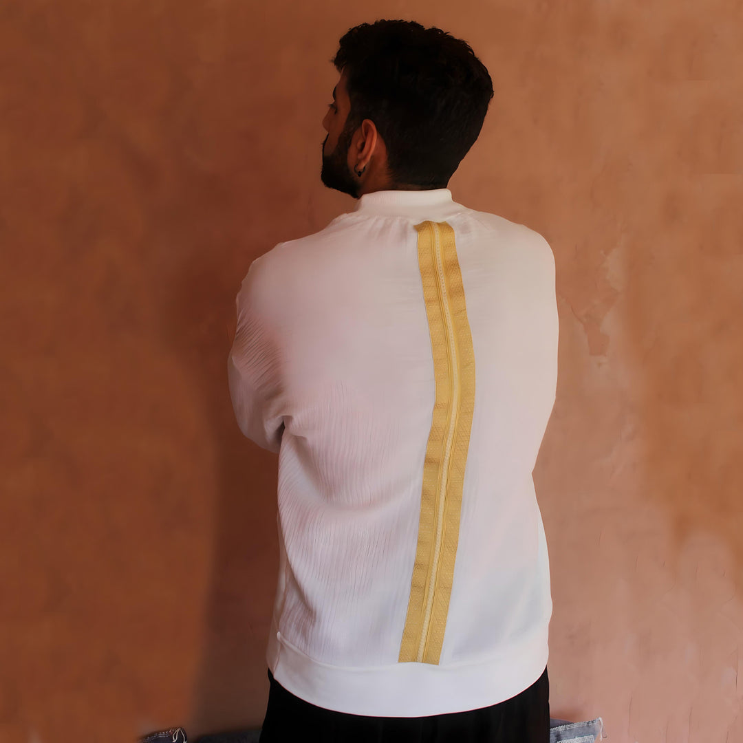 The back view of the Long Slim Sleeves White and Gold Caftan T-shirt showcases a bold gold sfifa silk trim running vertically down the center, highlighting the luxurious craftsmanship and design.