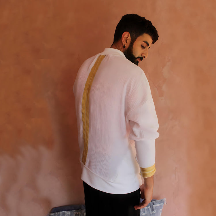 A right side angle, displaying the long sleeves with intricate gold sfifa trim, enhancing the traditional Moroccan design elements.