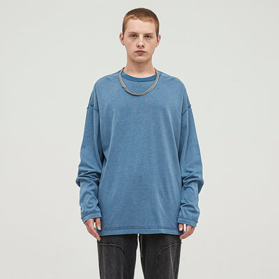 Featuring our model in the Medium Blue Oversized Long Sleeve T-Shirt, this piece highlights how vintage meets contemporary in a look that's effortlessly stylish.