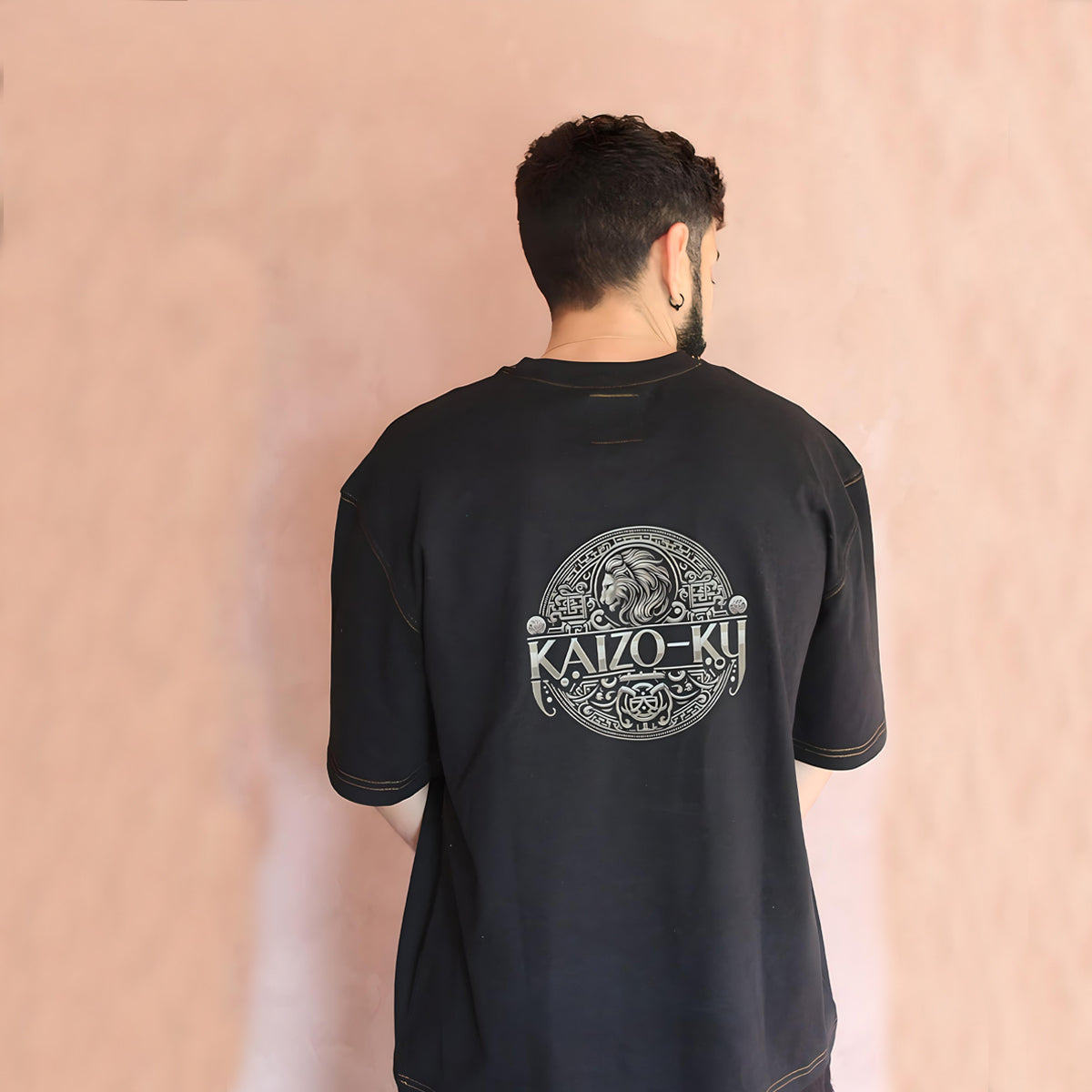 Back view of the Lion's Pride Oversized T-Shirt highlighting the intricate design inspired by Moroccan culture and the majestic Atlas lion.