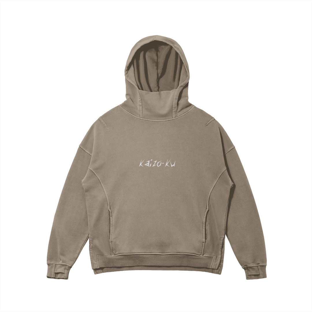 Flat front view of the Kaizo-Ku oversized hoodie in Khaki. Features a turtle neck hood, embroidered logo, and a split hem for better movement.