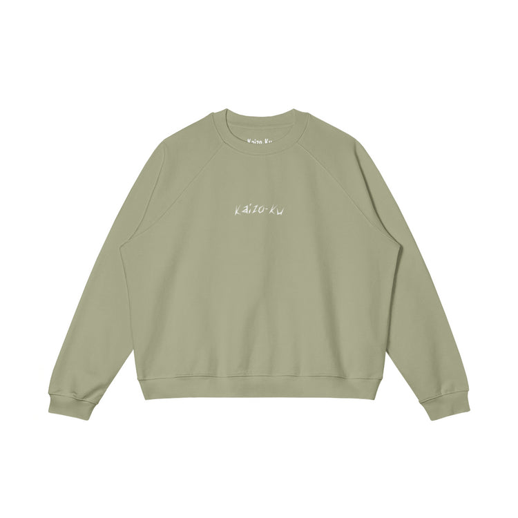 Front view of the oversized sweatshirt from Kaizo-Ku in Matcha Green, with the subtle embroidered "Kaizo-Ku" logo. Unique, minimalistic, and on-trend.