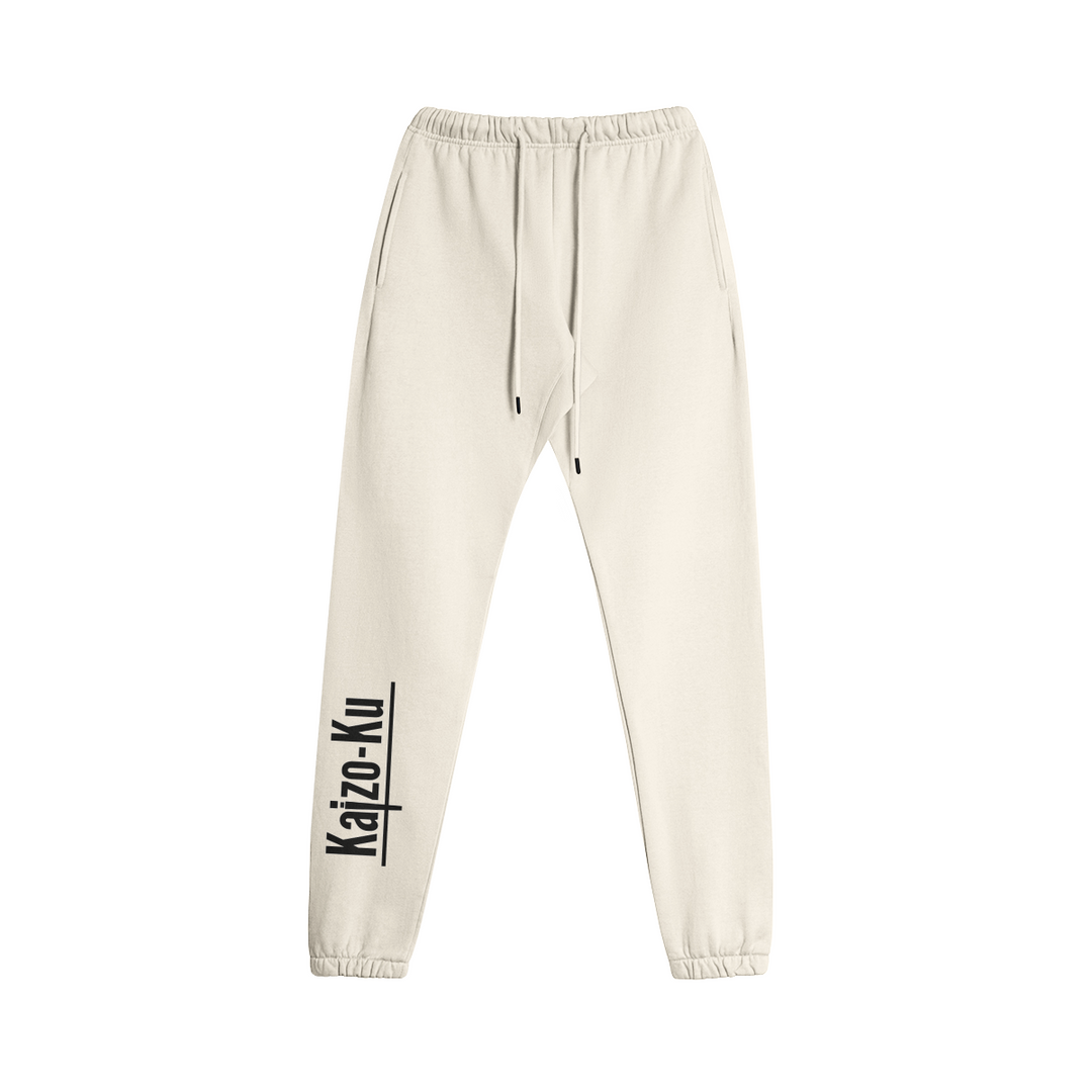 Flat front view of the Kaizo-Ku oversized jogger in Beige. Features a relaxed fit with side pockets and an adjustable waistband for ultimate comfort.