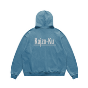 The Shadow Blue Oversized Vintage Hoodie, viewed from the back, highlights its timeless design and the soothing blue shade, promising a stylish yet comfortable addition to your spring collection.