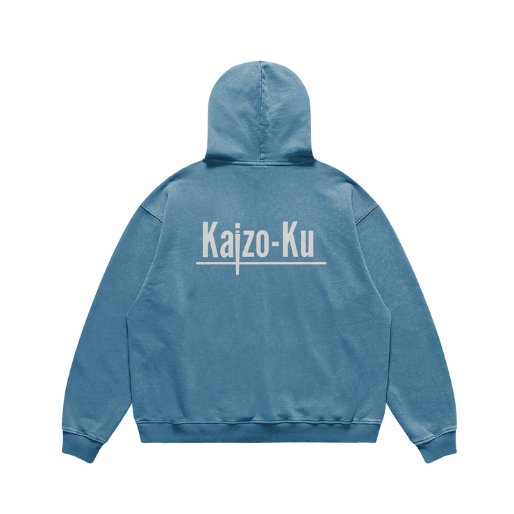 The Shadow Blue Oversized Vintage Hoodie, viewed from the back, highlights its timeless design and the soothing blue shade, promising a stylish yet comfortable addition to your spring collection.