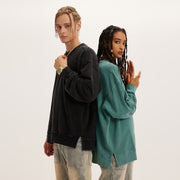 Showcasing the dynamic duo of our Spring 2024 Collection, the image features a man in our oversized black sweatshirt and a woman in the green variant, both embodying the essence of urban street style and comfort. Perfect for those who appreciate the blend of versatility and fashion-forward design in their streetwear.