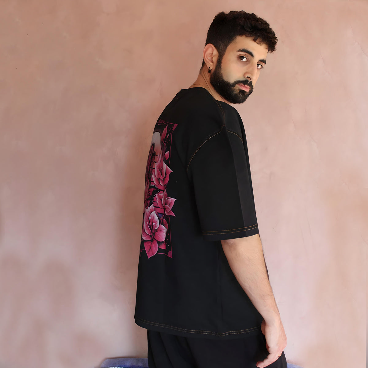 Experience the perfect blend of comfort and design with our Sunny Blossom Oversized Black T-Shirt. The right side view highlights its flawless construction and attention to detail, making it a staple in any streetwear enthusiast's collection. This t-shirt embodies the spirit of Kaizo-Ku, where fashion meets function in every stitch.