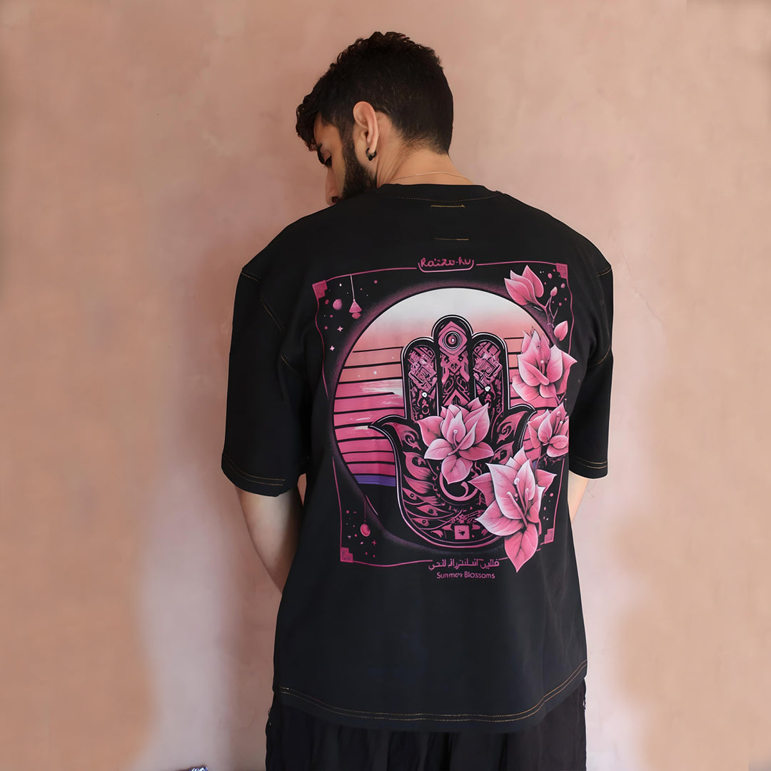 Turn heads with the artistic back design of the Sunny Blossom Oversized Black T-Shirt. This unique piece features a detailed graphic that captures the essence of modern urban fashion, ensuring you make a bold statement from every angle. The oversized fit adds a touch of effortless cool, making it ideal for those who want to express individuality through their wardrobe.