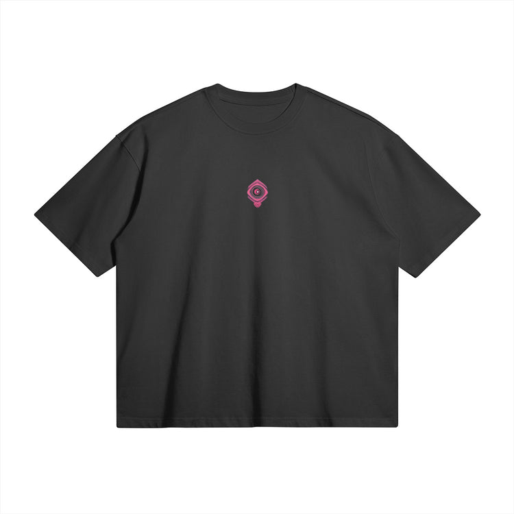 The front view of the Sunny Blossoms Oversized Summer T-shirt features a minimalist design with a small, stylish emblem at the chest. The simple yet elegant look complements the detailed artwork on the back, making it a versatile addition to your streetwear wardrobe, ideal for summer days and nights.