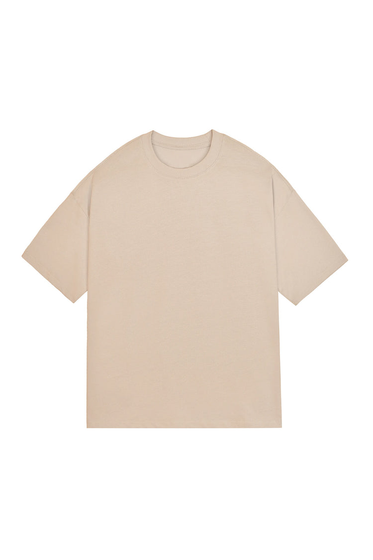 T-shirt oversize beige en coton peigné, coupe ample et col rond vu de face