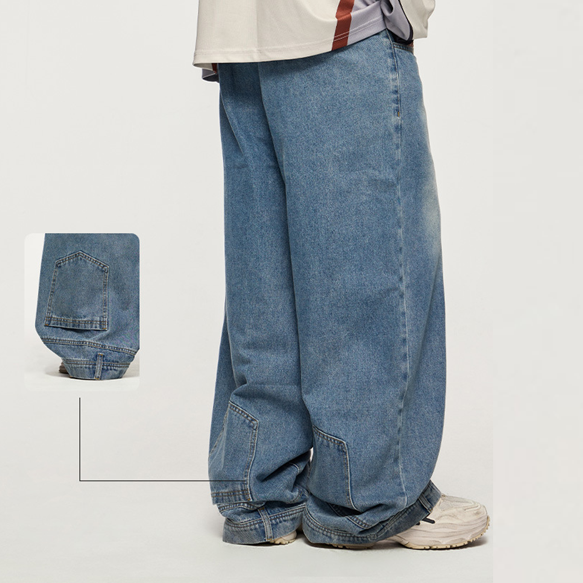 Back view of the Kaizo-Ku Upside Down Denim Jeans worn by a model. The oversized fit and flipped back pockets create a unique, unconventional look perfect for streetwear enthusiasts.