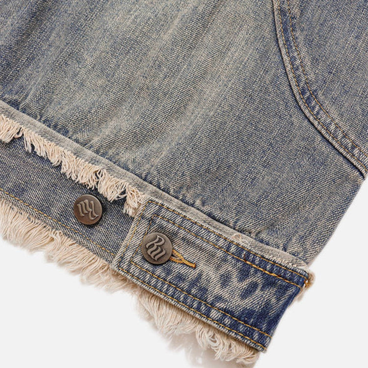 a close look up at the weist hemp of the denim hoodie designed by kaizoku showcasing the distressed hem and raw buttons for a vintage style.
