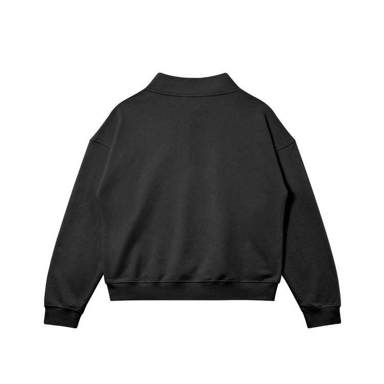 Flat back view of the Kaizo-Ku zip collar sweater in Black. Oversized fit for a relaxed streetwear look, ideal for layering.