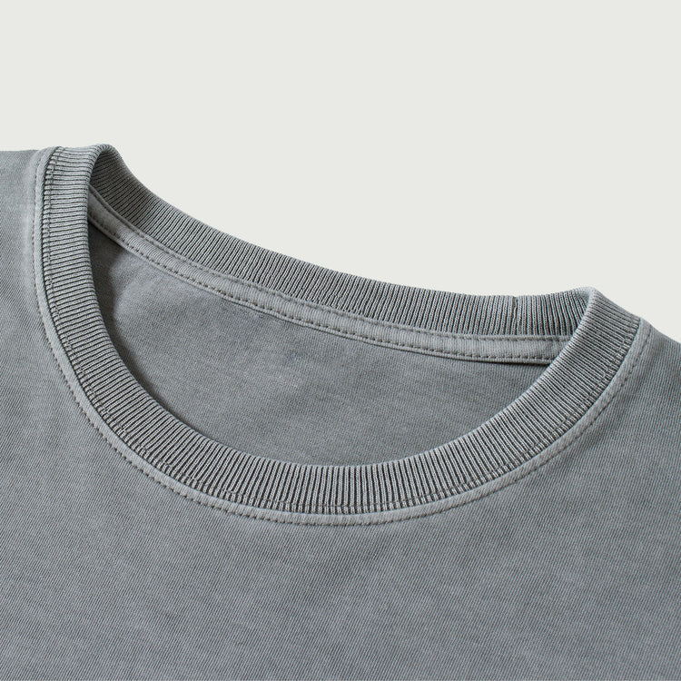 Close-up of the collar on the Kaizo-Ku oversized 2-in-1 t-shirt in Dark Grey. High-quality finish for ultimate comfort, perfectly complementing the embroidered logo.