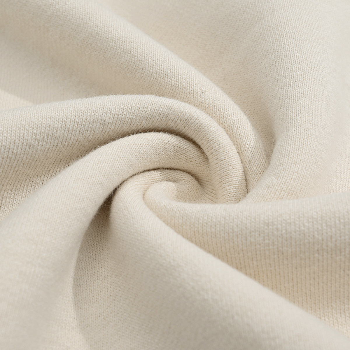 Close-up of the fabric on the Kaizo-Ku zip collar sweater, highlighting the eco-friendly materials used for a soft, comfortable feel.