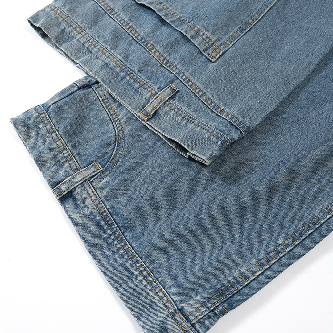 Close-up of the hem detailing on the Kaizo-Ku Upside Down Denim Jeans. The wide-leg construction and clean hem finish enhance the oversized streetwear vibe.