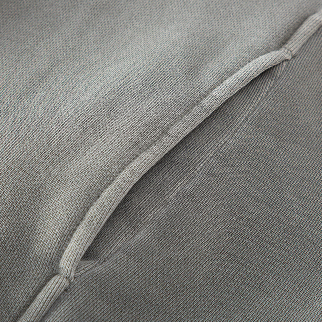 Close-up of the kangaroo pocket on the Kaizo-Ku hoodie, offering both functionality and a clean design aesthetic.