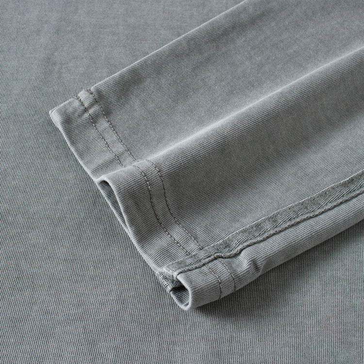 Detail of the double-layered sleeve design on the Kaizo-Ku oversized 2-in-1 t-shirt in Dark Grey. Features high-end stitching for a seamless look.