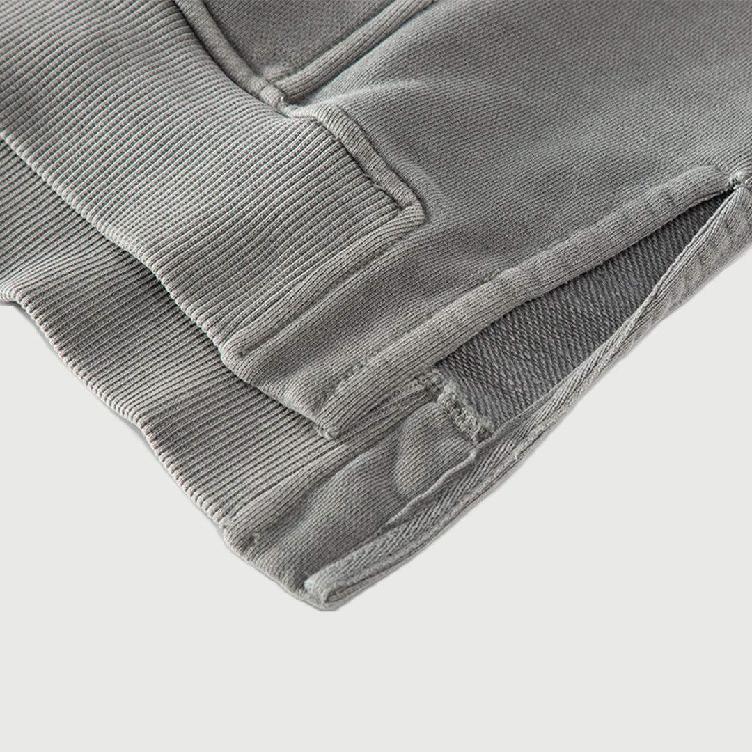 Close-up of the split hem on the Kaizo-Ku oversized hoodie. Designed for extra comfort and flexibility, perfect for layering.